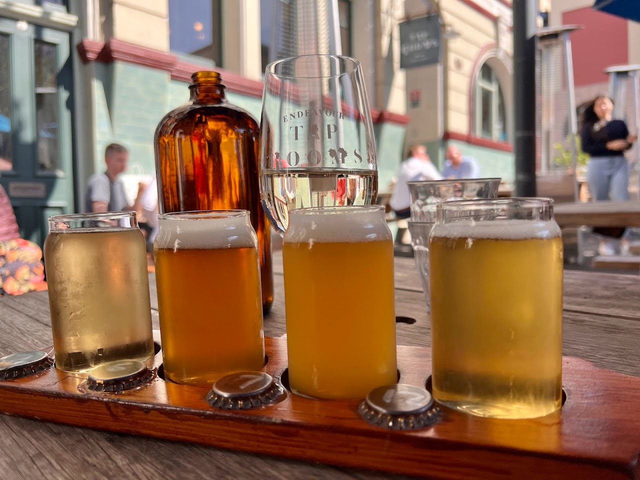 A tasting paddle of Endeavour beers on an outdoor table